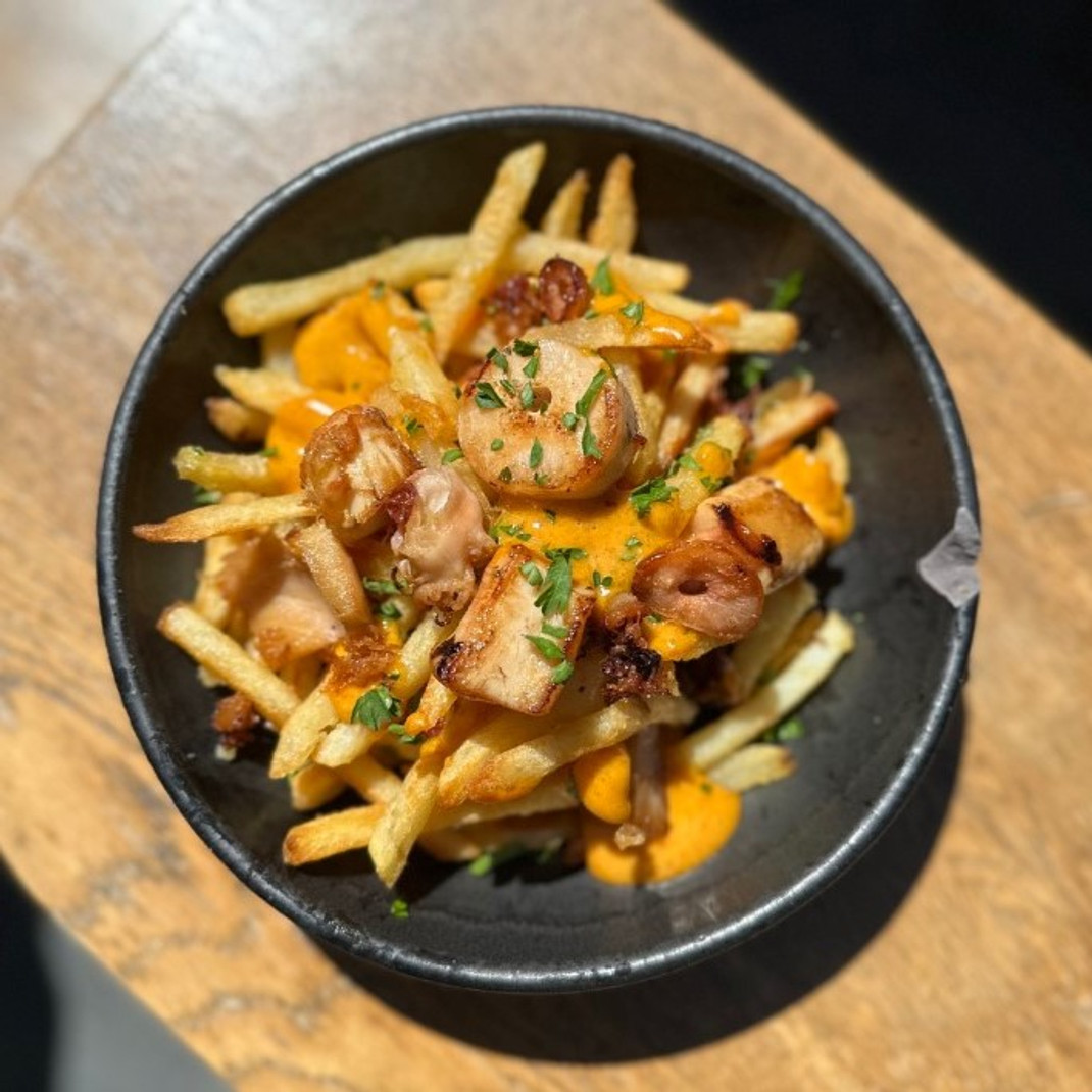 Garlic French Fries Topped With Octopus & Spicy Paprika Aioli By Ali Hooke Garlic French Fries Topped With Octopus & Spicy Paprika Aioli By Ali Hooke