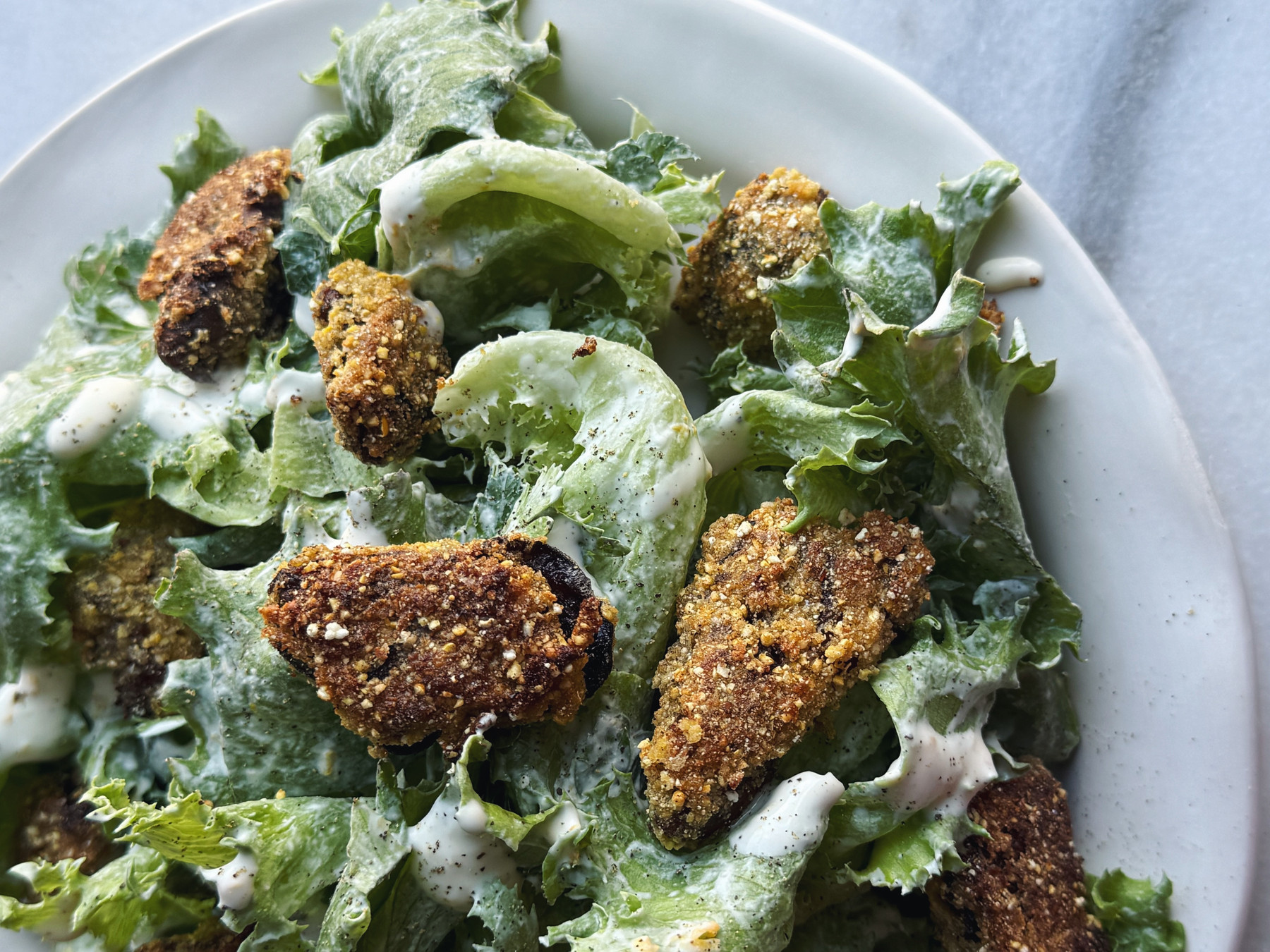 Crispy Lettuces with Cornmeal Fried Lemon Pepper Oysters and Lemon Creme Fraiche Crispy Lettuces with Cornmeal Fried Lemon Pepper Oysters and Lemon Creme Fraiche