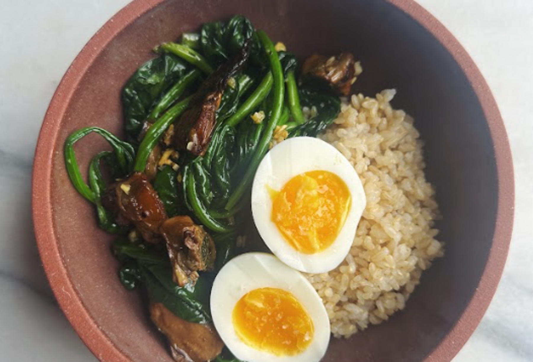 Brown Rice Breakfast Bowl with Garlicky Spinach and Smoked Oysters 