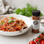 Penne pasta with rich tomato sauce, roasted garlic, basil, parmesan, and savory tomato basil garlic seasoning flavor.