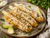 Mexican street corn with lime, herbs, and seasoning inspired by Milford Spice Street Corn blend