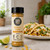 Milford Spice Company Street Corn seasoning bottle styled with street corn tacos, cotija-style cheese, cilantro, and lime in a bright kitchen setting.