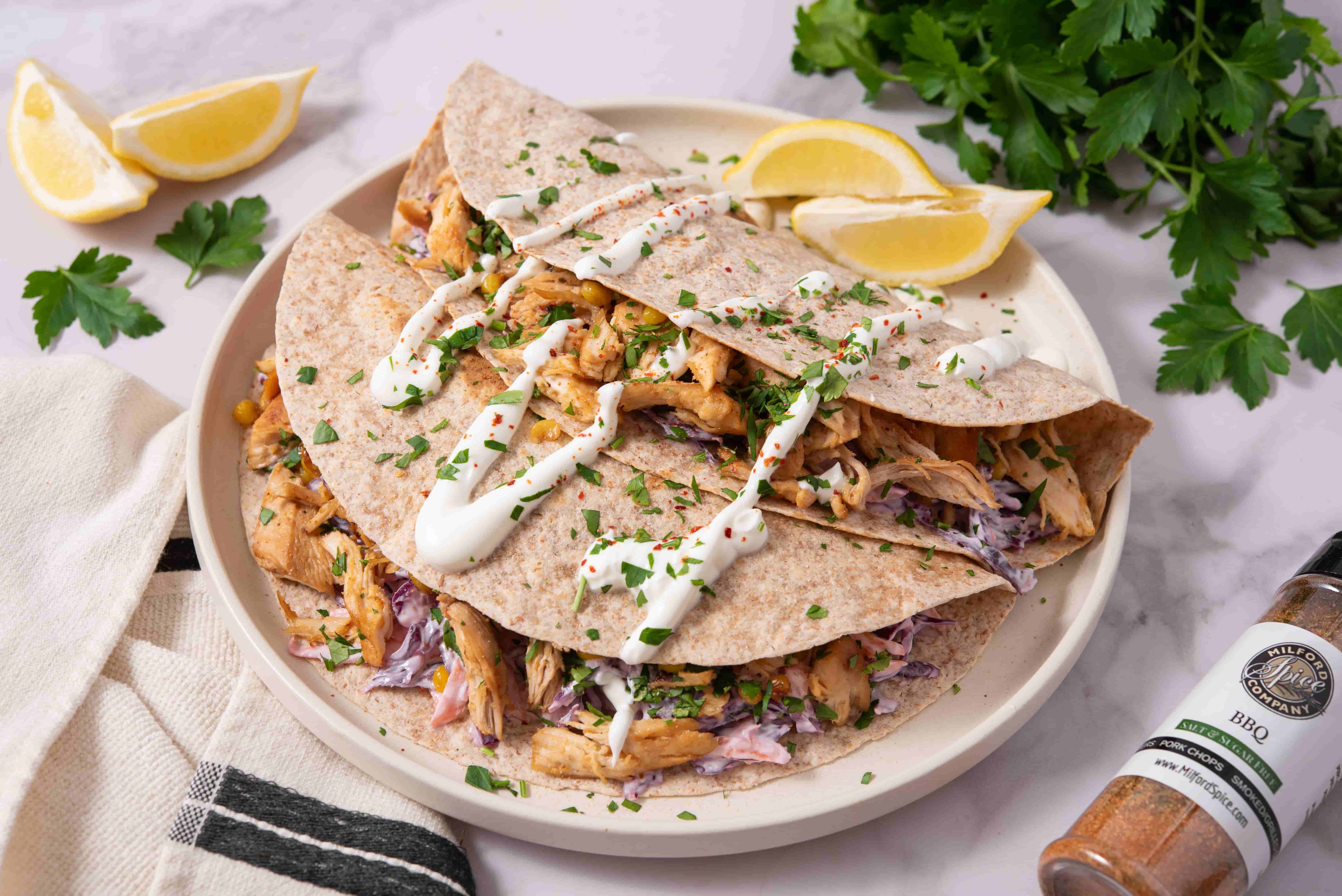 BBQ Chicken Tortilla Folds filled with shredded BBQ chicken, sweet corn, and creamy cabbage slaw
