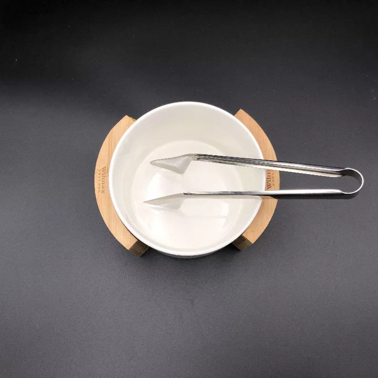 Individual small salad bowl set with serving tongs and a Bamboo stand