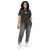 Woman wearing high-wasted pants and a black tee featuring an original illustration of a crazed frog