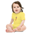Baby in a yellow, short sleeve baby onesie featuring an original illustration of a flamingope