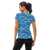 Woman in athletic t-shirt featuring light blue abstract print (back view)