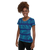 Woman in athletic tee shirt featuring blue abstract stripe print (side view)
