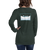 Woman missing part of her head is wearing a forest green, long sleeve tee shirt featuring an original snowy Tahoe graphic