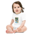Baby in a white, short sleeve baby onesie featuring an illustration of a white lab puppy sitting on a swimmer's starting block
