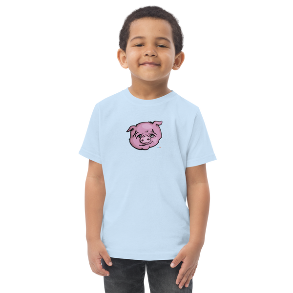Toddler in light blue t-shirt featuring an original illustration of a pig