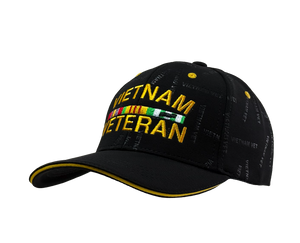 Right side view of Vietnam Veteran Patterned Print Cap highlighting bold embroidered Vietnam Veteran text, yellow accent brim, and patterned design. Right side view of Vietnam Veteran Patterned Print Cap highlighting bold embroidered Vietnam Veteran text, yellow accent brim, and patterned design.