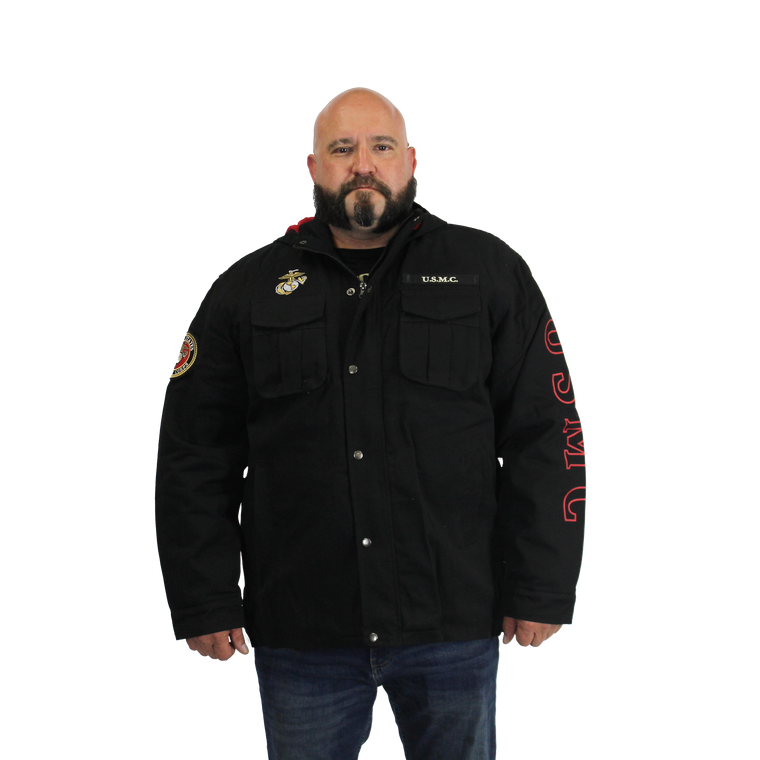 Model wearing the front view of U.S. Marines Hooded Canvas Jacket featuring thermal hood lining and printed USMC graphic.