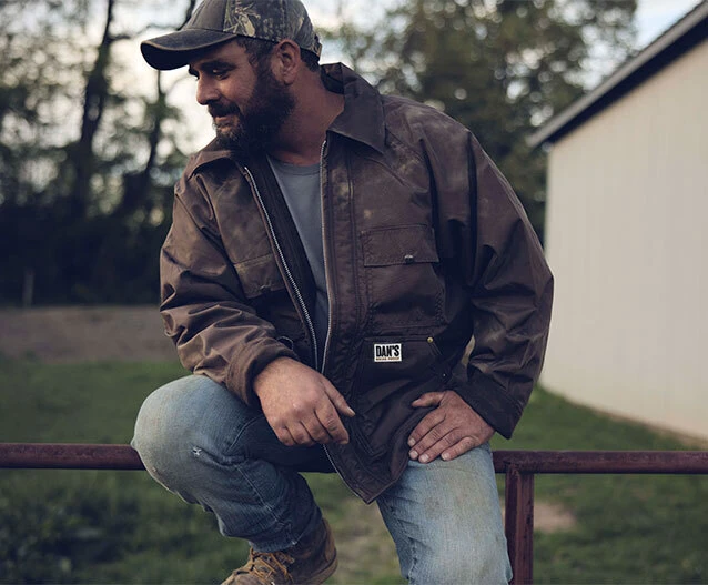 Man sitting on a fence