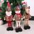 Three plush Christmas standing dolls