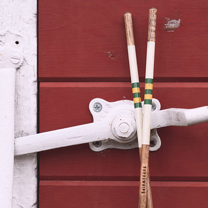 Alignment sticks leaning on shed
