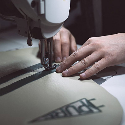 Hands sewing Pure golf accessories