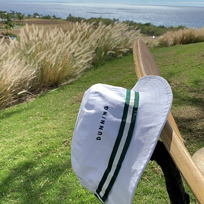 Imperial Headwear cap on the back of a chair