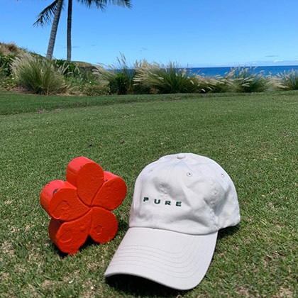 Imperial Headwear cap on grass