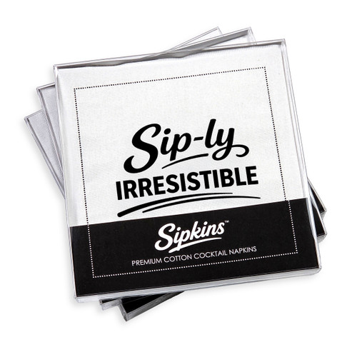 pack of 24 Sipkins™ premium cotton cocktail napkins in a clear box