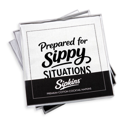 pack of 24 Sipkins™ premium cotton cocktail napkins in a clear box