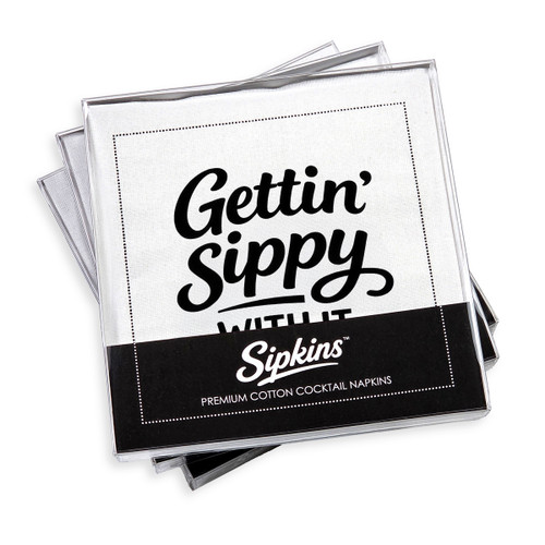 pack of 24 Sipkins™ premium cotton cocktail napkins in a clear box
