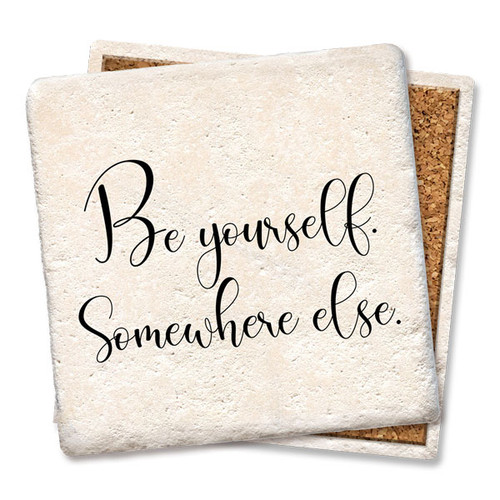 Coaster made of absorbent stone & cork back printed with Be yourself, somewhere else.
