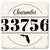 Coaster made of natural absorbent ceramic with full cork back printed with custom zip code and city state