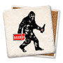 Coaster made of absorbent stone & cork back printed with bigfoot carrying a six pack of beer