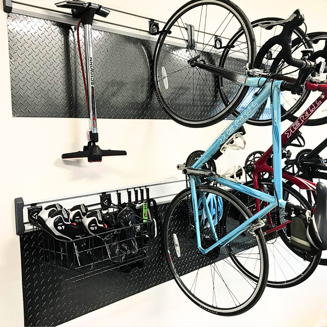 Gunmetal diamond plate used as a protective wall cover for a bike rack inside of a garage.
