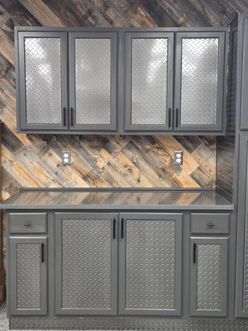 Industrial mancave with wood walls and Gunmetal diamond plate cabinets