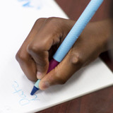 A hand writes using the Tran-Quill Crayon. "Wake up" the hand with vibration without affecting the handwriting (no squiggly lines)