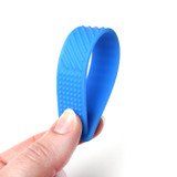 Hand bending the blue Sensory Bookmark / Fidget - rub the textures, bend them, use them as a bookmark. Endless fidgety fun!