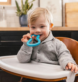 Baby chewing the Baby Guitar; a great chew for sensory exploration