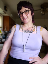 An adult wears the Krypto-Bite nec