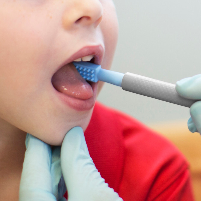 A therapist uses the Probe Tip with her young client - one of the tips you can select for your Build Your Own ARK Z-Vibe Kit!