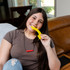 A teen girl chews on the Rainbow Chewable Fidget - a super textured, thin chewy fidget great for tactile sensory fun.