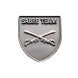 Silver JROTC Sabre Team medal in shield form showcasing two crossed sabres as the central design element.