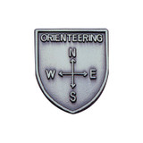 Silver JROTC Orienteering shield medal with a raised four-point compass and labeled directional markers.
