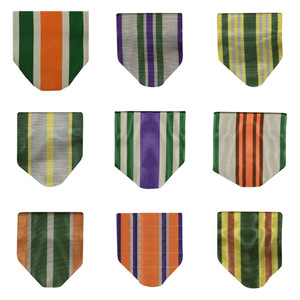 Regulation ARMY JROTC ribbon drape awards with ribbon drape have a pin, safety catch, and a gold ring at the bottom to hold a medal featuring series numbers. Regulation ARMY JROTC ribbon drape awards with ribbon drape have a pin, safety catch, and a gold ring at the bottom to hold a medal featuring series numbers.