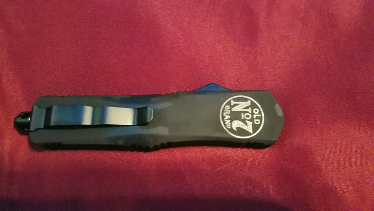 Laser etched into the handle.