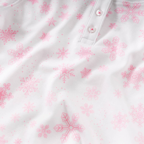 Dreaming of a white Christmas? Our Pink Snowflakes Pajamas by Petidoux bring the magic of winter to bedtime.