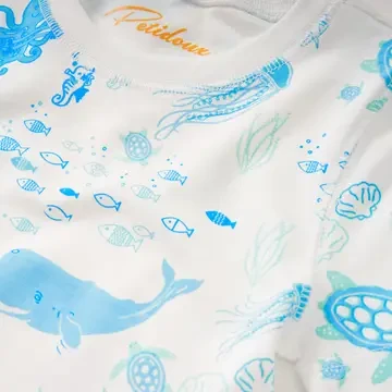Dive into dreamland with our Petidoux Under the Sea Summer Pajamas! These delightful pajamas bring the magic of the ocean to bedtime.