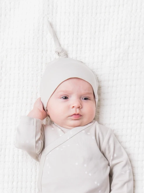 Wrap your little one in comfort with the Classic Knotted Hat from Colored Organics.