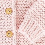 This pink blush cardigan pairs perfectly with dresses, skirts, or jeans, making it a must-have for every stylish child.