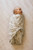 This versatile baby swaddle features a charming Leafy Sprig Gray pattern, adding a touch of modern elegance to your baby's layette.