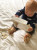 Introduce your baby to the wonderful world of Sophie la Girafe with this engaging and practical Waddle Rattle Socks Set. It's a delightful way to stimulate their senses and keep their little feet snug!