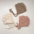 Keep your little one cozy and stylish with The Blueberry Hill Popcorn Bonnet in a beautiful cream color.