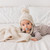 Playful furry pom-pom adds a touch of whimsy. Coordinates with our matching sweaters and blankets