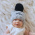 Whether you're hitting the ice or just enjoying a snowy day, this Huggalugs beanie provides the perfect blend of warmth and style.